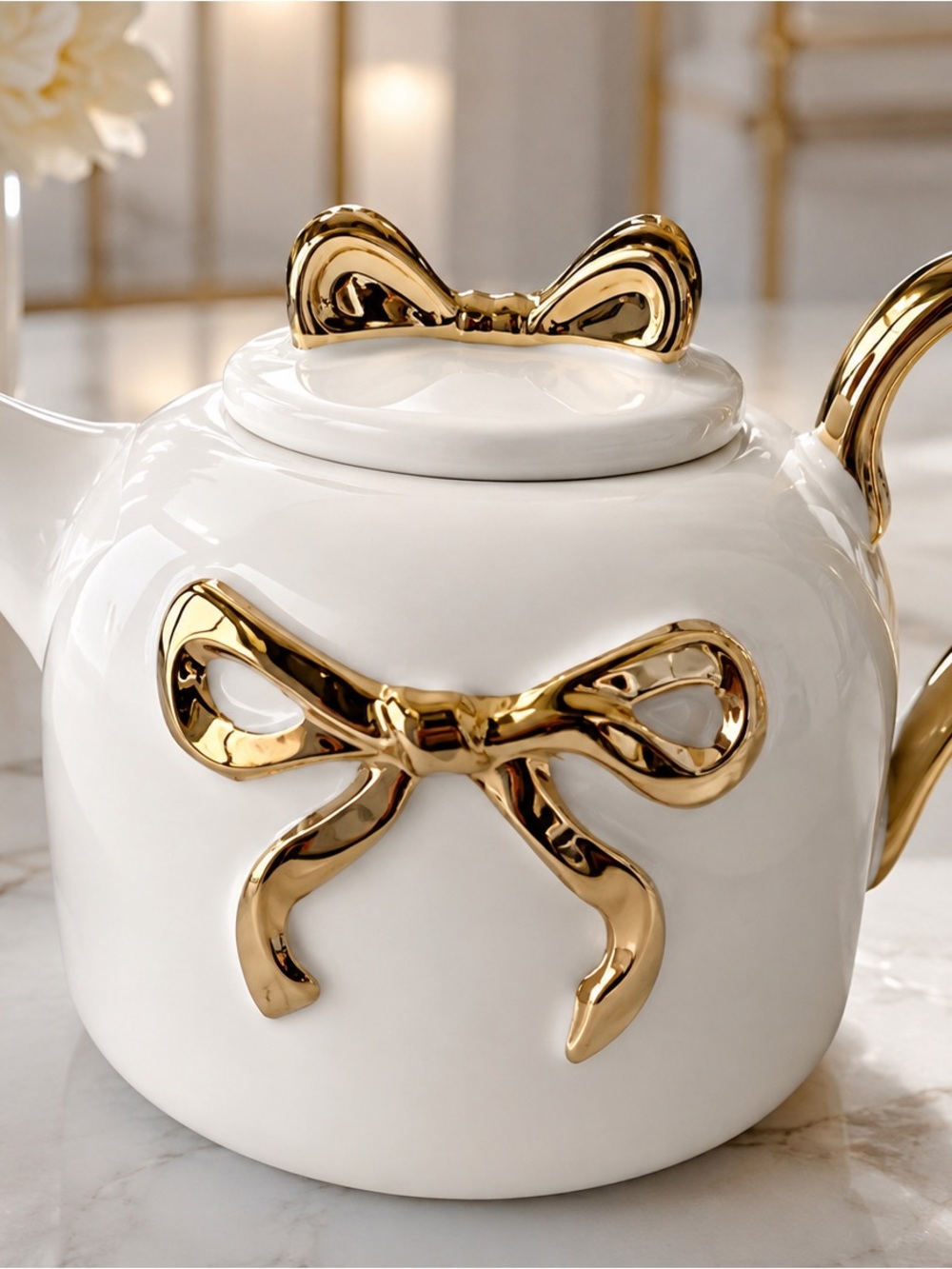 White Ceramic Teapot with Gold Bow Accents